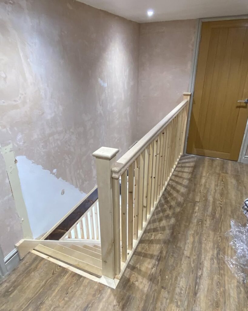 Landing balustrade with square newel post and spindles fitted by GT Joinery