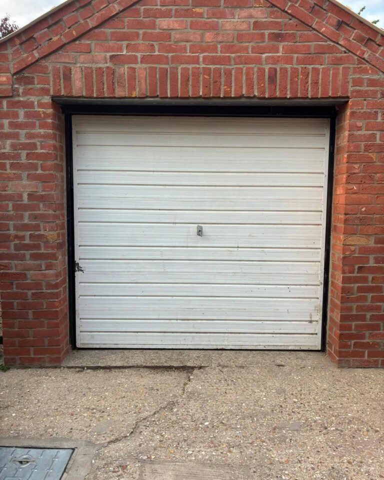 Old up-and-over garage door before GT Joinery fitted new timber doors
