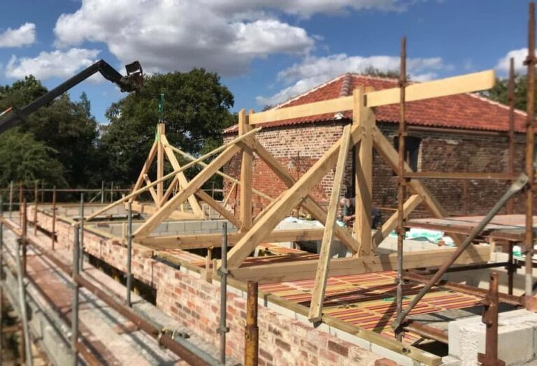 Roof trusses and roofing carpentry on a brick extension by GT Joinery